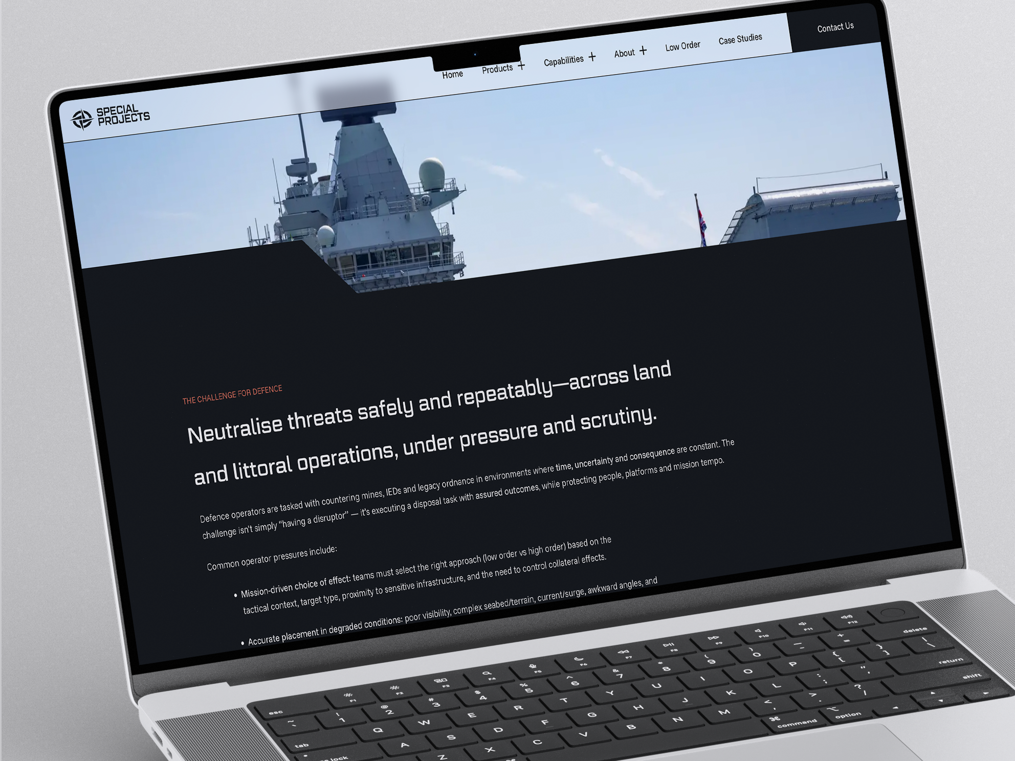 Special Projects website on a laptop, with a naval vessel in the header